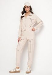 Jasnobeżowy Komplet Dresowy Bluza Rozpinana i Spodnie Slim w Stylu Utility Telavienna. Brązowe bluzy damskie Born2be, m, bez wzorów, z dresówki, eleganckie, bez ramiączek, bez kaptura. Za 84.99 zł.