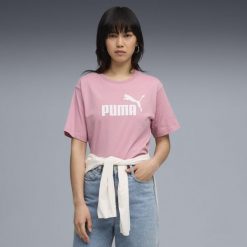 Damska luźna koszulka Essentials z logo No.1 PUMA Poised Pink. Czerwone bluzki damskie Puma, bez wzorów, z gumy, sportowe, bez kołnierzyka, bez ramiączek. Za 99.00 zł.