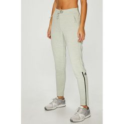 Adidas Performance - Spodnie. Zielone spodnie dresowe damskie adidas Performance, bez wzorów, z dzianiny. W wyprzedaży za 249.90 zł.