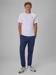 4F Spodnie casual joggery męskie - denim XL. Niebieskie spodnie materiałowe męskie 4F, bez wzorów, z bawełny, z standardowym stanem. Za 179.99 zł.
