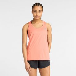 Koszulka damska New Balance WT51253FAR – pomarańczowa. Brązowe bluzki damskie New Balance, xs, z aplikacjami, z materiału, sportowe, bez kołnierzyka, bez ramiączek. Za 59.99 zł.