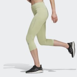 Legginsy damskie adidas 3/4 Own The Run Running. Zielone legginsy damskie Adidas, bez wzorów, z materiału. W wyprzedaży za 145.55 zł.