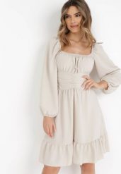 Beżowa Sukienka Auxede. Brązowe sukienki damskie Born2be, na imprezę, bez wzorów, z tkaniny, bez kołnierzyka, bez ramiączek, mini, rozkloszowane. Za 69.99 zł.