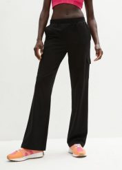 Spodnie sportowe z elastycznego materiału z bawełną. Czarne spodnie dresowe damskie bonprix, bez wzorów, z bawełny, sportowe. Za 109.99 zł.