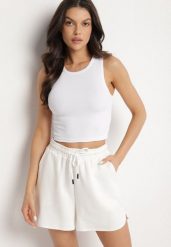 Biały Krótki Tank Top z Prążkowanej Tkaniny Nevallia. Białe topy damskie Born2be, l, bez wzorów, z jeansu, eleganckie, bez kołnierzyka, bez ramiączek. Za 29.99 zł.