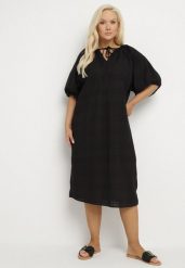 Czarna Bawełniana Sukienka Oversize z Wiązaniem pod Szyją Tolanea. Czarne sukienki damskie Born2be, l, bez wzorów, z bawełny, bez kołnierzyka, bez ramiączek, midi, oversize. Za 74.99 zł.