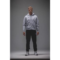 Kurtka z kapturem Erima Cmpt Wings Szara Junior. Czarne kurtki męskie Erima, bez wzorów, z materiału, sportowe, z kapturem. Za 329.99 zł.