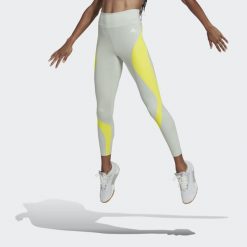 Legginsy Kobieta Adidas Hiit Colorblock zielony. Zielone legginsy damskie Adidas, bez wzorów. Za 234.05 zł.