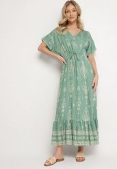 Zielona Sukienka Rozkloszowana z Wiskozą w Boho Wzór z Falbaną Turaline. Zielone sukienki damskie Born2be, na lato, l, bez wzorów, z wiskozy, boho, bez kołnierzyka, bez ramiączek, maxi, rozkloszowane. Za 74.99 zł.