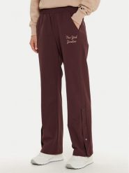 Champion Spodnie dresowe 117511 Brązowy Wide Leg. Brązowe spodnie dresowe damskie Champion, bez wzorów, z dresówki. Za 239.99 zł.