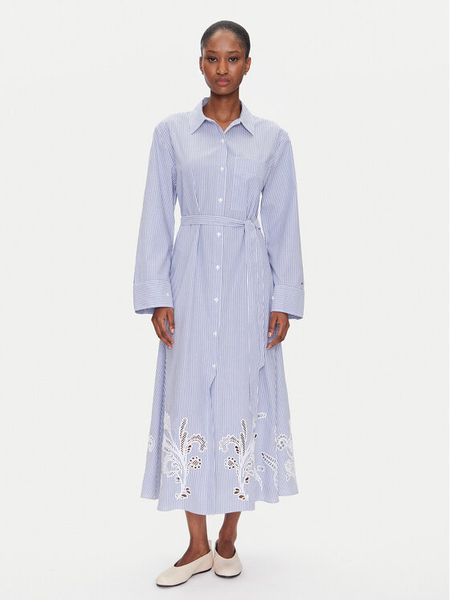 Tommy Hilfiger Sukienka koszulowa WW0WW44660 Błękitny Regular Fit. Niebieskie sukienki damskie Tommy Hilfiger, bez wzorów, z bawełny, bez kołnierzyka, bez ramiączek, koszulowe. Za 559.99 zł.