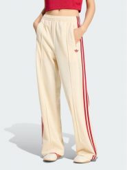 Adidas Spodnie dresowe Firebird Loose Tracksuit KS4671 Kremowy Loose Fit. Białe spodnie dresowe damskie Adidas, bez wzorów, z dresówki. Za 298.99 zł.