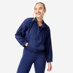 Bluza sportowa damska Domyos. Niebieskie bluzy damskie DOMYOS, s, bez wzorów, z elastanu, sportowe, bez ramiączek, bez kaptura. Za 159.99 zł.