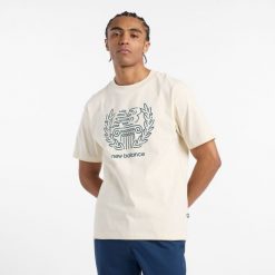 Koszulka męska New Balance MT51974LIN – beżowa. Brązowe koszulki sportowe męskie New Balance, m, bez wzorów, z bawełny, bez ramiączek. Za 139.99 zł.