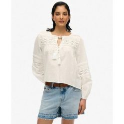 Bluzka z koronki Ibiza. Białe bielizna sportowa damska Superdry, bez wzorów, z koronki. Za 284.00 zł.