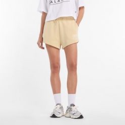 Spodenki damskie New Balance WB61Y80AABC – żółte. Żółte szorty damskie New Balance, bez wzorów, z bawełny, klasyczne. Za 199.99 zł.