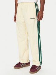 Adidas Spodnie dresowe Cutline Track Tracksuit Bottoms KW8021 Kremowy Regular Fit. Białe komplety dresowe męskie Adidas, m, bez wzorów, z dresówki. Za 329.99 zł.