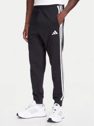 Adidas Spodnie dresowe Essential 3-Stripes JD1881 Czarny Regular Fit. Czarne spodnie sportowe męskie Adidas, m, bez wzorów, z bawełny. Za 159.99 zł.