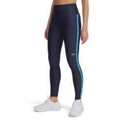 Legginsy Under armour model 6006027-403 dla kobiet. Niebieskie legginsy damskie Under Armour, bez wzorów, z materiału. Za 280.97 zł.