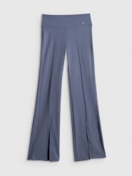 4F Spodnie do jogi z rozszerzanymi nogawkami damskie - niebieskie XL. Niebieskie spodnie dresowe damskie 4F, bez wzorów, ze skóry, sportowe, z podwyższonym stanem, długie, na jogę i pilates. Za 169.99 zł.