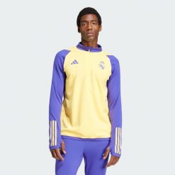 Bluza Real Madrid Tiro 23 Training. Żółte bluzy męskie Adidas, xl, bez wzorów, z materiału, eleganckie, bez ramiączek, bez kaptura. W wyprzedaży za 277.40 zł.
