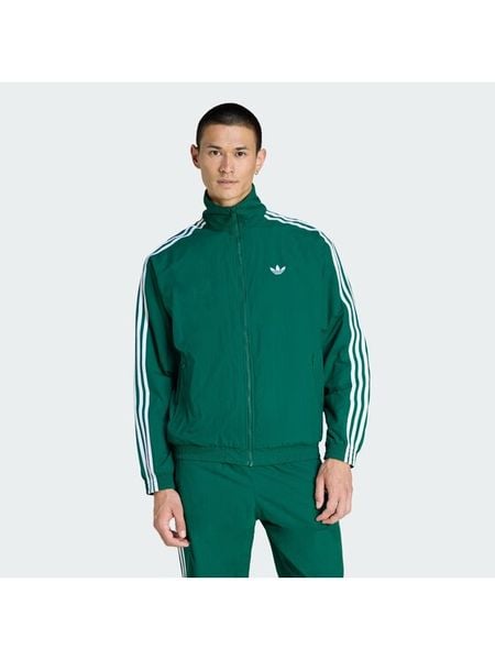 Adidas Bluza Firebird KC8018 Zielony Regular Fit. Zielone bluzy męskie Adidas, l, bez wzorów, z syntetyku, bez ramiączek, bez kaptura. Za 349.99 zł.
