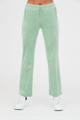 JUICY COUTURE Seledynowe spodnie dresowe Tina. Niebieskie spodnie dresowe damskie Juicy Couture, bez wzorów, z dresówki. W wyprzedaży za 229.99 zł.