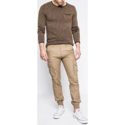Produkt by Jack & Jones - Spodnie. Brązowe spodnie materiałowe męskie PRODUKT by Jack & Jones, bez wzorów, z bawełny. W wyprzedaży za 119.90 zł.