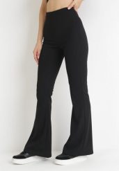 Czarne Spodnie Dzwony z Gumką w Pasie Milica. Czarne spodnie materiałowe damskie Born2be, bez wzorów, z jeansu, eleganckie, z podwyższonym stanem. Za 89.99 zł.