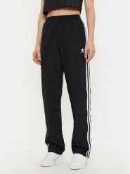 Adidas Spodnie dresowe Woven JD5335 Czarny Loose Fit. Czarne spodnie dresowe damskie Adidas, bez wzorów, z dresówki. Za 239.99 zł.