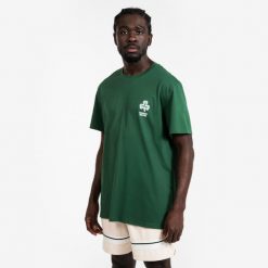 Koszulka do gry w koszykówkę unisex Tarmak NBA Celtics TS 900. Zielone bluzki damskie TARMAK, s, bez wzorów, z bawełny, sportowe, bez kołnierzyka, bez ramiączek. Za 79.99 zł.