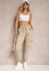 Beżowe Bawełniane Spodnie Bojówki z Gumką w Talii i Kieszeniami Zolarae. Brązowe spodnie materiałowe damskie Renee, bez wzorów, z bawełny, eleganckie. Za 49.99 zł.