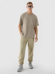 4F Spodnie dresowe oversize męskie - oliwkowe/khaki M. Brązowe spodnie materiałowe męskie 4F, m, bez wzorów, z bawełny. W wyprzedaży za 79.99 zł.