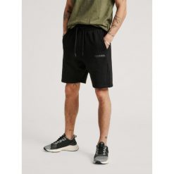 Spodenki Sportowe Hummel Hmllegacy Shorts. Czarne buty sportowe męskie Hummel, bez wzorów, bez zapięcia, na fitness i siłownię. Za 92.00 zł.