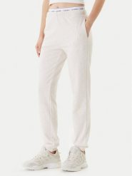 Guess Spodnie dresowe O5RB01 KCO31 Beżowy Regular Fit. Brązowe spodnie dresowe damskie Guess, z aplikacjami, z bawełny. Za 209.99 zł.