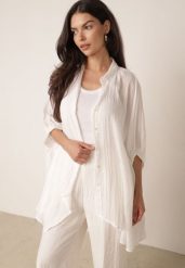 Biała Zwiewna Koszula Letnia Oversize z Bawełny o Nietoperzowym Kroju Canomela. Białe koszule damskie Born2be, l, bez wzorów, z bawełny, eleganckie, bez kołnierzyka, bez ramiączek. Za 139.99 zł.