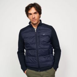 Kurtka do golfa męska ciepła CW900 hybrydowa. Niebieskie kurtki męskie INESIS, l, bez wzorów, z dzianiny, eleganckie, bez kaptura. Za 179.99 zł.