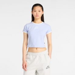 Koszulka damska New Balance WT61Y33QDYK – fioletowa. Fioletowe bluzki damskie New Balance, m, bez wzorów, z bawełny, eleganckie, bez kołnierzyka, bez ramiączek. Za 169.99 zł.