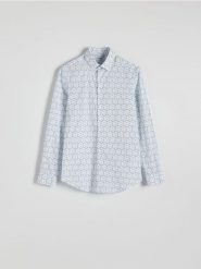 Koszula slim fit w drobne kwiaty - jasnoniebieski. Niebieskie koszule męskie Reserved, l, bez wzorów, z bawełny, bez kołnierzyka, bez ramiączek. W wyprzedaży za 79.99 zł.