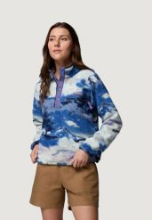 Damska krótka bluza Columbia Helvetia™ II z nadrukiem, rozpinana na zatrzaski. Fioletowe bluzy damskie Columbia, xs, bez wzorów, z polaru, bez ramiączek, z kapturem. Za 364.65 zł.