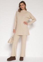 Beżowy Prążkowany Komplet Dzianinowy z Bawełną Sweter z Półgolfem i Spodnie Elweda. Brązowe swetry nierozpinane damskie Born2be, bez wzorów, z bawełny, klasyczne, bez kołnierzyka, bez ramiączek. Za 109.99 zł.
