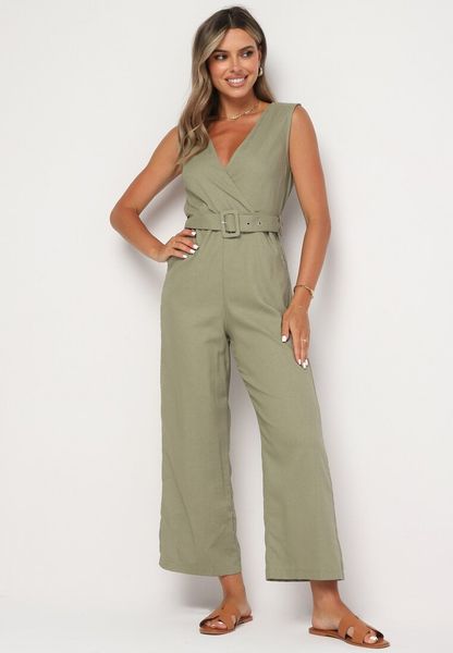 Ciemnozielony Kopertowy Kombinezon z Bawełny z Gumką w Talii Szerokimi Nogawkami i Paskiem Hralfrea. Zielone sukienki damskie Born2be, na co dzień, na lato, l, bez wzorów, z bawełny, eleganckie, bez kołnierzyka, bez ramiączek, dopasowane. Za 109.99 zł.