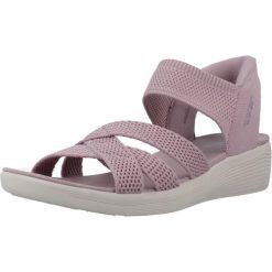 Sandały SKECHERS SLIP-INS ARYA Fioletowy. Fioletowe sandały damskie Skechers, bez wzorów, z tkaniny, bez obcasa, bez zapięcia. Za 490.00 zł.