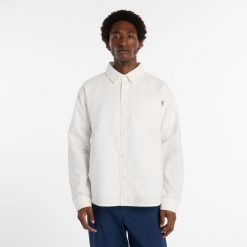 Koszula męska New Balance MT53523RFN – biała. Białe koszule męskie New Balance, m, bez wzorów, z bawełny, eleganckie, bez kołnierzyka, bez ramiączek. Za 389.99 zł.