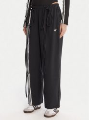 Adidas Spodnie dresowe Ribbon Parachute JV9727 Czarny Loose Fit. Czarne spodnie dresowe damskie Adidas, bez wzorów, z dresówki. Za 349.99 zł.