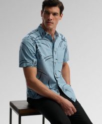 Superdry Koszula Vintage Loom krótki rękaw z bawełny organicznej. Niebieskie koszule damskie Superdry, xl, bez wzorów, z bawełny, klasyczne, bez kołnierzyka, bez ramiączek. Za 229.00 zł.