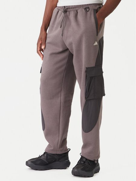 Adidas Spodnie dresowe JV8022 Brązowy Regular Fit. Brązowe spodnie sportowe męskie Adidas, l, bez wzorów, z dresówki. Za 339.99 zł.