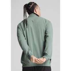 Męska kurtka do biegania VELOCITY PUMA Green Moon. Zielone kurtki męskie Puma, m, bez wzorów, bez kaptura, do biegania. W wyprzedaży za 169.00 zł.
