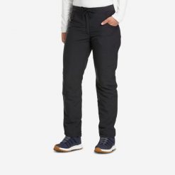 Spodnie turystyczne damskie Quechua NH100 Warm. Czarne spodnie sportowe damskie QUECHUA, bez wzorów, z materiału, sportowe, trekkingowe. Za 129.99 zł.