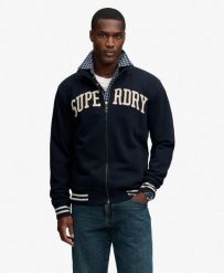 Superdry Vintage Athletic kurtka dresowa luźny krój. Niebieskie kurtki męskie Superdry, xl, z aplikacjami, z bawełny, vintage, bez kaptura. Za 408.75 zł.